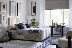 DFS Bryony King Size Ottoman Bed Frame in Cream Velvet, available from 18.10.23, Dwell Zya Accent Chair, Dwell Alcina Terrazzo Lamp Table, available at DFS, Dwell Lerato Artwork, available at DFS, Dwell Cosma Black Ribbed Office Desk, available at DFS, Dwell Comida Print Dining Chair in Black and Grey, available at DFS, DFS Kalel Medium Rug, Dwell Niscemi Reversible Medium Rug, available at DFS