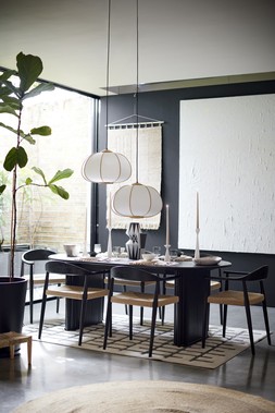 DFS Dwell Cosma dining table, available at DFS, Dwell Cosma dining chair in Black Oak and Rattan, available at DFS, DFS Macie Medium Rug