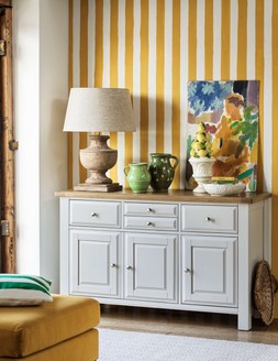 Furniture Village Furnitureland Hamilton Large Sideboard, &pound;699 Delaney Urn Table Lamp, &pound;249 The Lounge Co. Romilly Fabric Footstool in Golden Spice, &pound;429 Ives Rug in Natural, from &pound;99