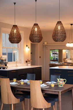 Wellington Wicker pendant lights over a kitchen table